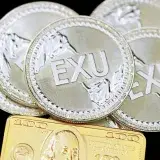 A group of Executium coins with a gold