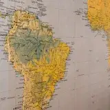 Close-up of a vintage-style map highlighting South America and parts of Africa.