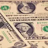 Detailed close-up of US one dollar bills showcasing intricate design and texture.