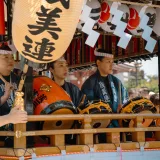 A vibrant scene of taiko drummers at a traditional Japanese festival in Tokyo.