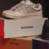 Close-up of trendy sneakers on Bad Bunny shoe box, ideal for fashion and retail themes.