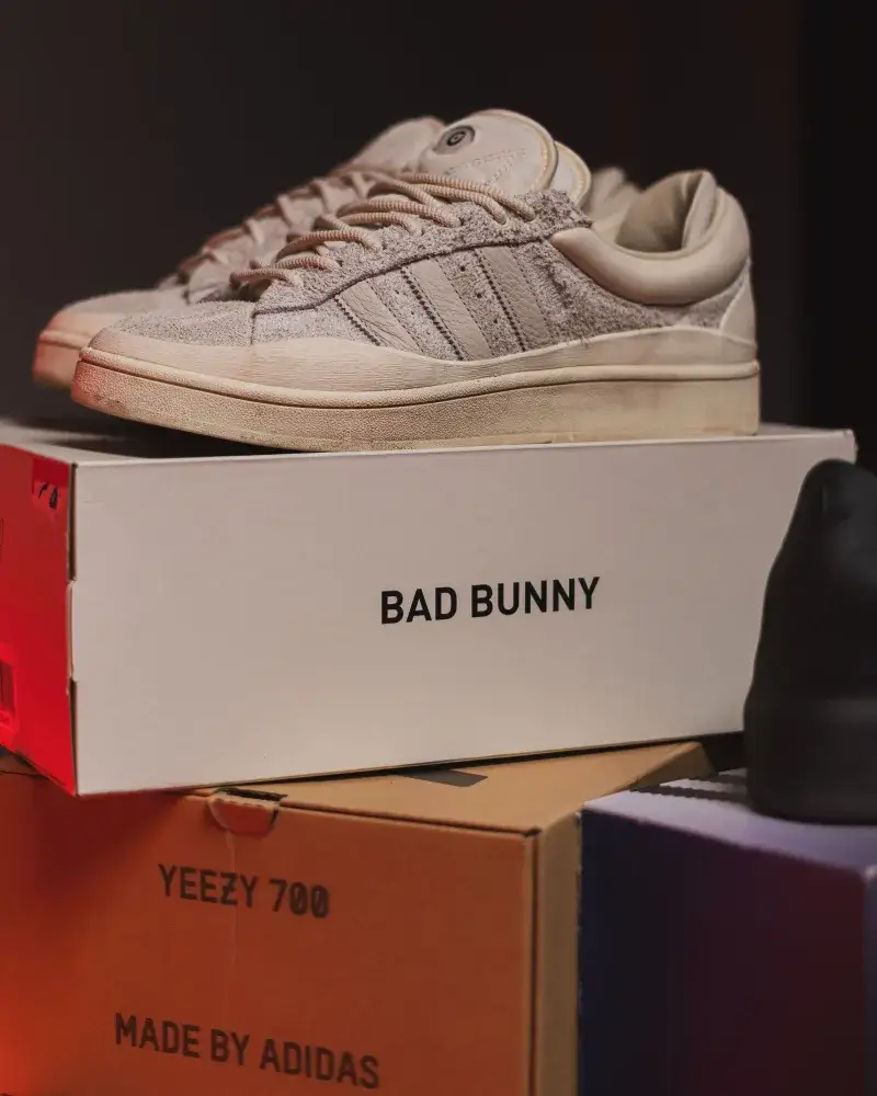 Close-up of trendy sneakers on Bad Bunny shoe box, ideal for fashion and retail themes.