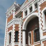 Explore the intricate red brick facade of a historic hacienda in Chiautla, Puebla, Mexico.