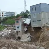 Severely damaged urban buildings after a landslide in Mocoa, Colombia, showcasing destruction.