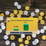 Bitcoin coins on wooden surface with chart showing market cap growth to 1.1T.
