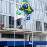 Flags waving outside Banco do Brasil headquarters in Brasília, Distrito Federal. Iconic Brazilian location indoors.
