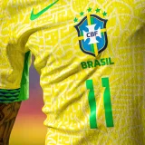 Detailed shot of a Brasil national football team's yellow jersey featuring emblem and number 11.