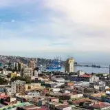 A scenic aerial view of Valparaíso, Chile, showcasing the city's vibrant architecture and bustling port.