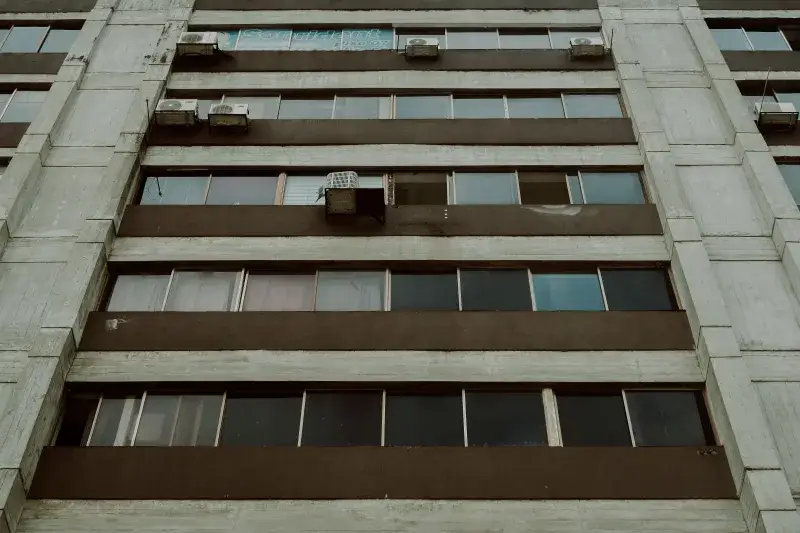 Low angle view of a modern apartment building facade with windows, Mérida, Venezuela.