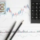 Stock analysis workspace featuring charts, a calculator, and currency for data-driven insights.