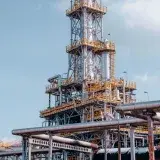View of a large oil refinery plant with intricate pipelines in Trzebinia, Poland.
